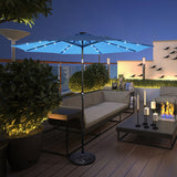 Outdoor patio with a large illuminated umbrella, sofa, and decorative elements on a wooden deck.