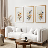 Modern living room with a white sofa, wooden coffee table, and Neutral Watercolor Wildflower Art Prints Set