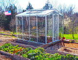 Janco Greenhouse in a garden with American flag in the background