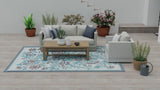 Living room with a gray sofa, wooden coffee table, and decorative Wildflowers Stone Terra rug.