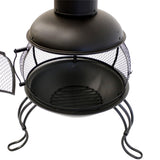 Black metal chiminea with mesh screen on a white background