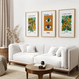 Living room with a white sofa, wooden coffee table, and colorful Modern Abstract Flower Market Set of 3 Piece