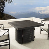 Outdoor patio table with chairs on a balcony with a scenic view of mountains and city lights.