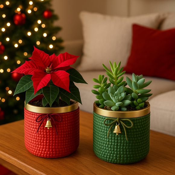 Two potted plants, one red and one green, on a table with a Christmas tree in the background Red or Green Bell Christmas Ceramic Planter – Single Piece – Festive Textured Design