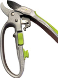 Gardening pruners with green handles on a white background