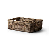 Woven brown basket on a white background