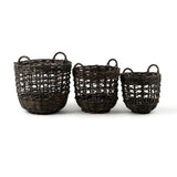 Three wicker baskets of different sizes on a white background
