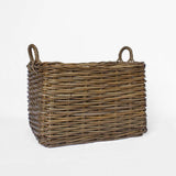 Wicker basket with handles on a white background