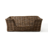 Woven brown basket with handles on a white background