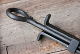 Black Mini Log Grabber & Fire Poker Set on a wooden surface