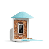 Bird feeder with a camera on a black background