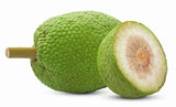 Whole and sliced breadfruit on a white background