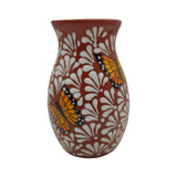 Ceramic vase with butterfly design on a white background