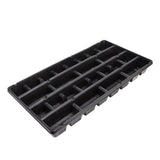 Black plastic seed tray with multiple compartments on a white background