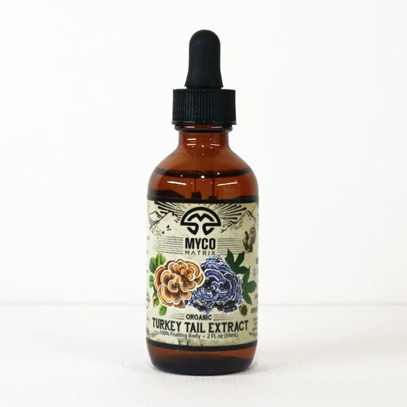 Brown glass bottle with dropper labeled 'Myco Matrix Turkey Tail Extract' on a white background