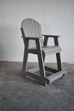 2' Standard Adirondack Chair - In Dining, Counter & Bar Heightson a concrete floor with a white wall background