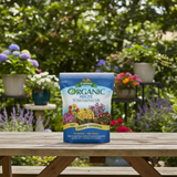 Espoma Organic Perlite bag on a wooden table with a garden background