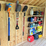 Wooden shed interior with tools and supplies on shelves