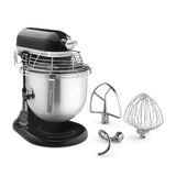 A KitchenAid stand mixer with a stainless steel bowl, black plastic body, and protective guard, shown with three metal attachments on a clean white background.