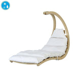 A curved wooden outdoor lounge chair with thick white cushions and a matching headrest pillow, shown on a plain white background with a small blue icon in the top-left corner.