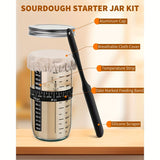 Sourdough starter jar kit shown on a wooden surface with callout labels pointing to the aluminum cap, breathable cloth cover, temperature strip, date marked feeding band, and silicone scraper.
