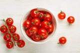 Heirloom Organic Large Cherry Tomato in a bowl on a white background