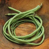 Heirloom Organic Yard Long Asparagus / Green Pod Red Seed Asparagus Bean on a wooden surface