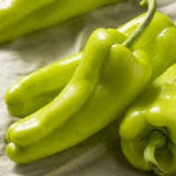Organic Heirloom Cubanelle/ Sweet Fryer Pepper on a textured surface