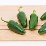 Organic Heirloom Jalapeno on a wooden surface