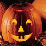 Heirloom Organic Jack O' Lantern Pumpkin on a rustic background