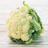 Heirloom Organic Snowball X Cauliflower on a wooden surface