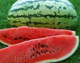 Watermelon with a slice cut open, revealing its red flesh and black seeds.