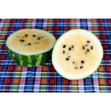 Halved RARE Heirloom Organic Yellow Petite Watermelon on a plaid fabric background