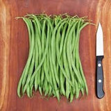 Bunch of Heirloom Organic French Filet Beans on a wooden cutting board with a knife