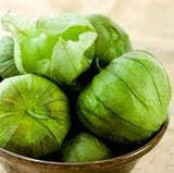 Heirloom Organic Green Tomatillo/ Mexican Husk Tomato in a wooden bowl on a wooden surface