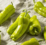 Organic Heirloom Cubanelle/ Sweet Fryer Pepper on a textured surface