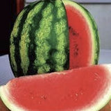 Whole and sliced Organic Heirloom AU Producer Watermelon on a wooden cutting board