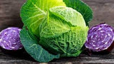 Heirloom Organic Danish Ballhead Cabbage on a wooden surface