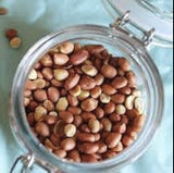 Heirloom Organic Raw Spanish Peanut on a light blue background