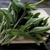 Bunch of Heirloom Organic Sage  Aka Salvia Officinalis Medicinal Herbs, Garden Sage, Smudging, Green Sage, Common Sage on a wooden cutting board