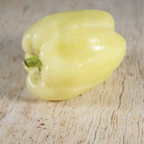 Heirloom Organic White Bell Pepperon a wooden surface