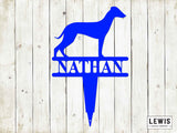 Blue whippet dog silhouette with 'Nathan' name on a wooden background, Lewis Design Company branding.