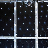 String lights on a black grid background