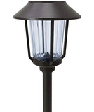 Black outdoor lamp post with clear glass shade on a white background