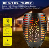 Decorative outdoor light with flame effect and safety features on a blurred background