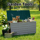 Gray garden tool storage box with tools and plants outdoors