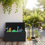 Black garden tool storage box with gardening tools on a patio
