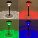 Solar-powered LED lamp showing red, green, and blue light on a neutral background.