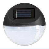 Solar-powered outdoor light with black casing on a white background