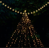 String lights arranged in a triangular pattern against a dark background